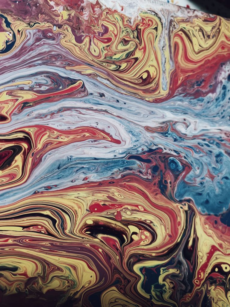 Creative design of oil artwork representing wavy flows and swirls with mix of paints blended with ink